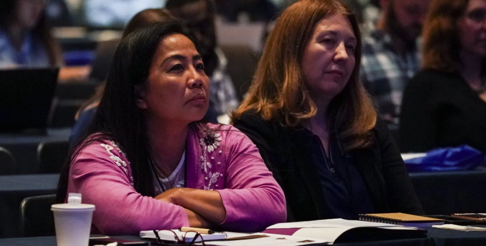 Conference attendees listening